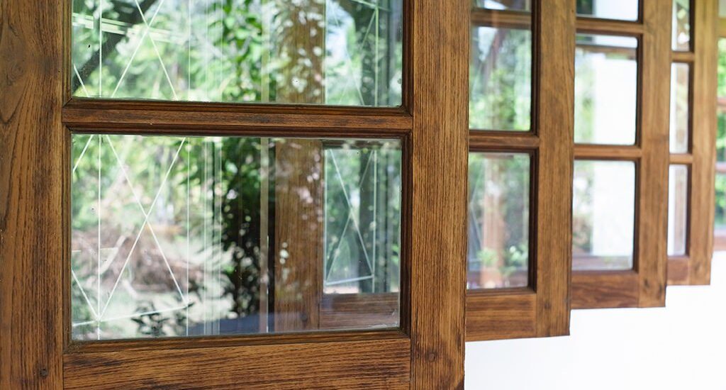 Close-up of a wooden-framed window, showcasing its craftsmanship and design, relevant to roofing services