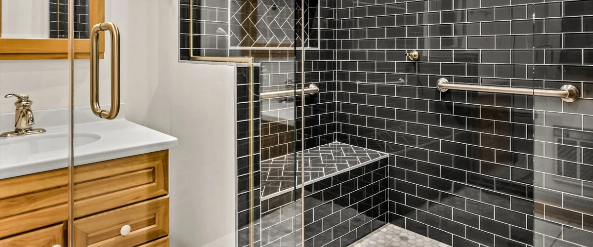 A modern living room featuring a couch and a television, with warm lighting and decorative elements.