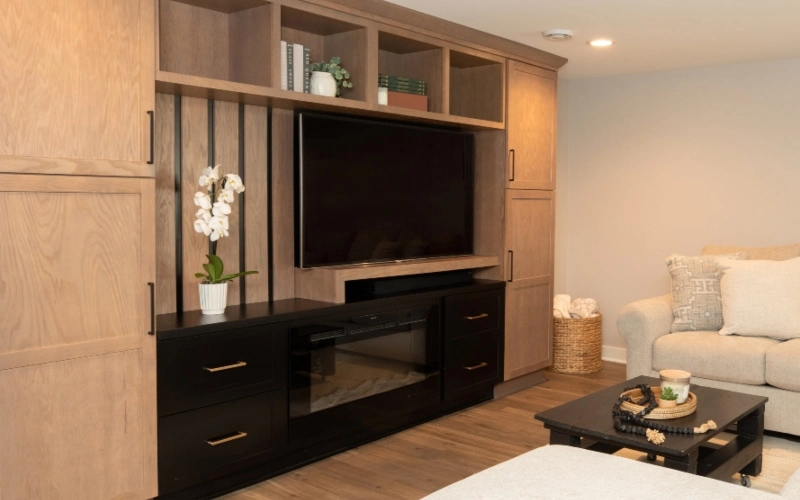 A cozy living room featuring a couch and a television, creating a comfortable space for relaxation and entertainment.