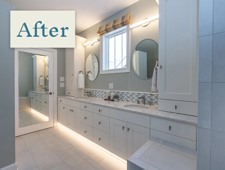 A modern bathroom featuring a stylish vanity and a large mirror above it, showcasing a clean and organized space.
