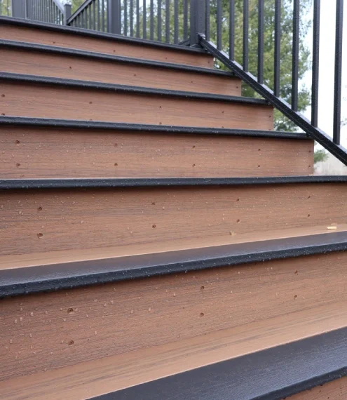 Close-up view of wooden stairs, showcasing the grain and texture of the wood.