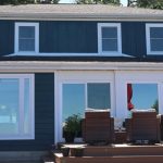 : Home exterior with new roof, siding and windows