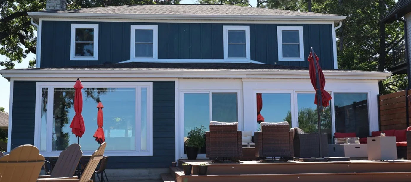 : Home exterior with new roof, siding and windows
